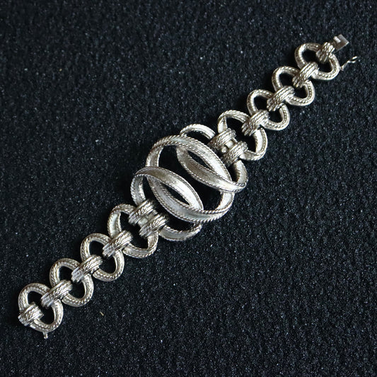 Vintage Carven Paris silver tone infinity cycles weaving bracelet